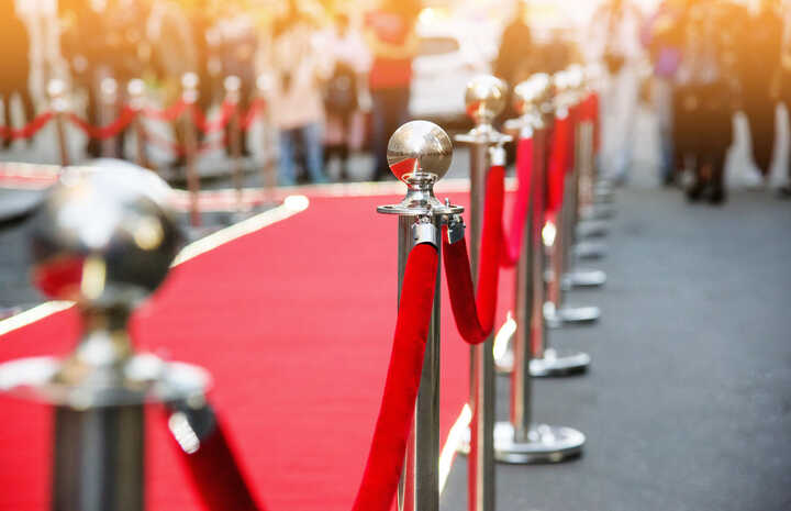 A red carpet and rope barrier
